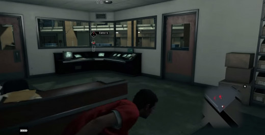Aiden, having freed himself from his cell, sneaks through the camera room of the Palin Correction Facility in the Dressed in Peels mission of Watch_Dogs.