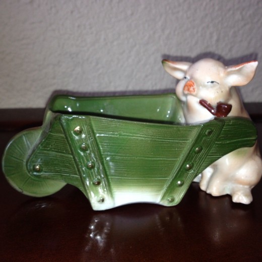 This pig pushing a wheelbarrow and smoking a pipe sold on ebay for $75. Rare.