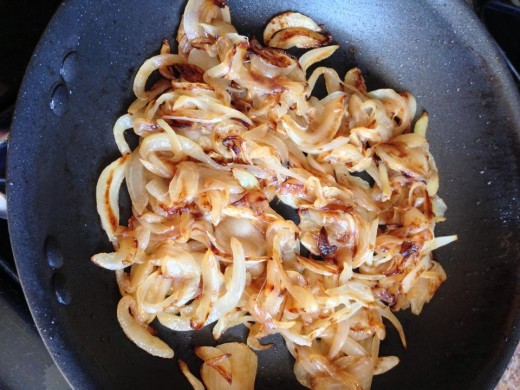 The sugars in the onions will cause them to brown. Stir frequently to avoid burning.