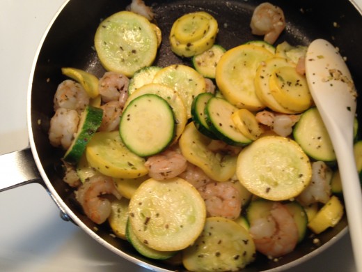 The shrimp should be a pinkish color when done and the veggies can be cooked to whatever doneness you prefer.