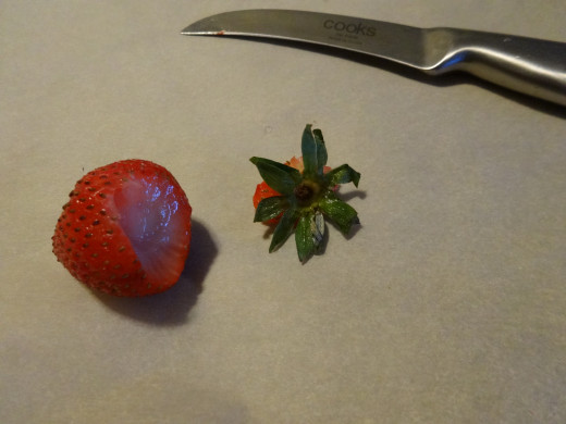 Cut off the "hull" of the strawberry.  