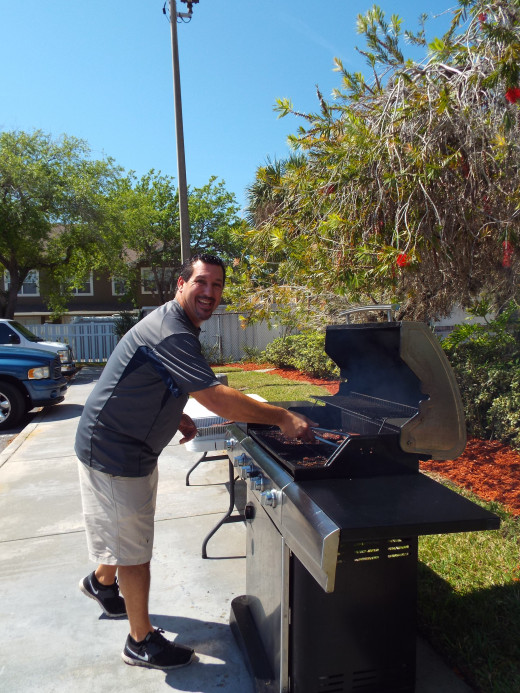 Pastor Marshick serving his community by cooking lunch for the volunteers & the homeless