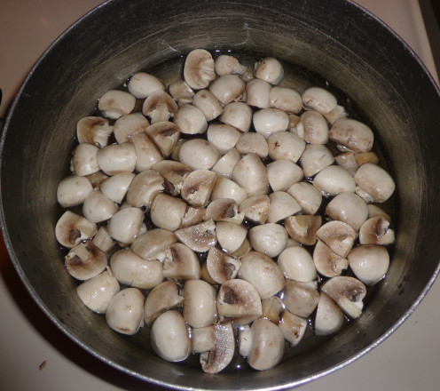 Mushrooms are getting boiled in water