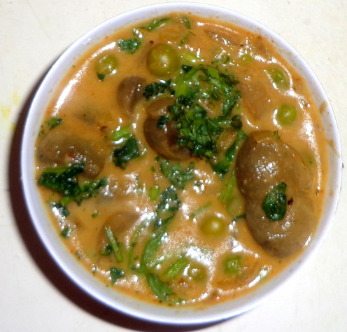 Coriander leaves are added on the Mutter Mushroom Curry or Green peas Mushroom curry for garnishing