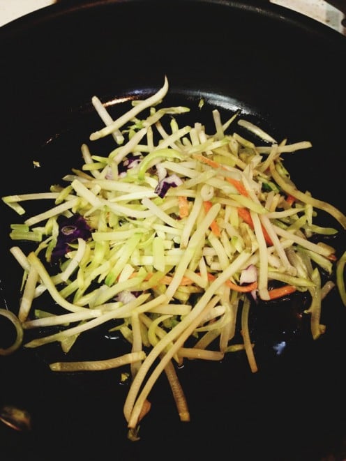 A version of Broccoli Slaw. Without the dressing, it is in a frying pan, waiting to be tossed with scrambled eggs or rolled into a omelet.