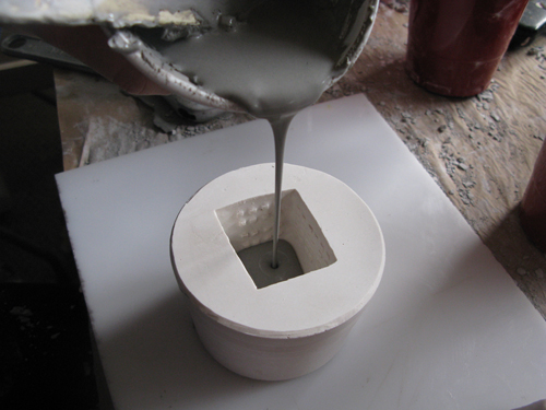 Slip being poured into a mold.