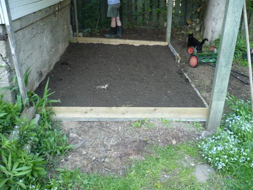 Fill to the top with topsoil and begin planting your vegetable plants.