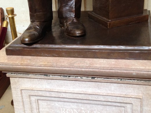 THE GRANITE LOOKING SUBSTANCE FOUR LAYERS BELOW PRESIDENT'S REAGAN'S FEET IS PART OF THE BERLIN WALL HE HELPED BRING DOWN