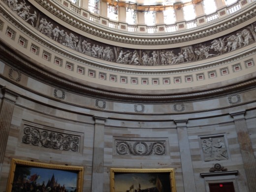 THE SCULPTURES AROUND THE BASE OF THE ROTUNDA TELLS THE STORY OF AMERICA UNTIL THE WRIGHT BROTHERS