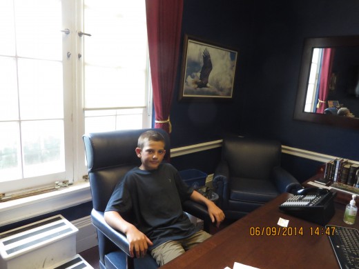 GRAYSON IN CONGRESSMAN YOHO's CHAIR.