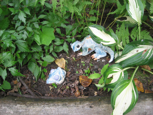 I tuck in a sculpture here and there to create a visual garden illustration.