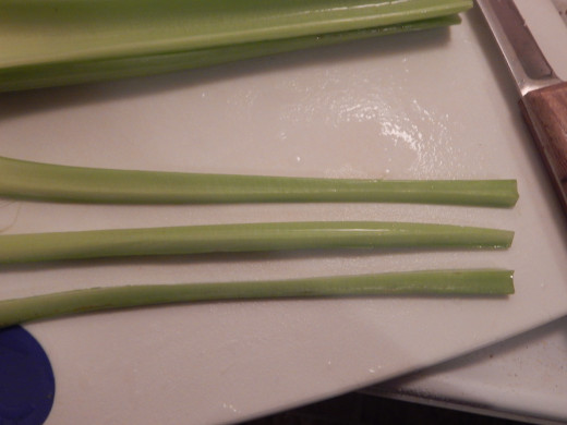 Splitting my celery stalk in three, length-wise.  Photo by JenPaxton