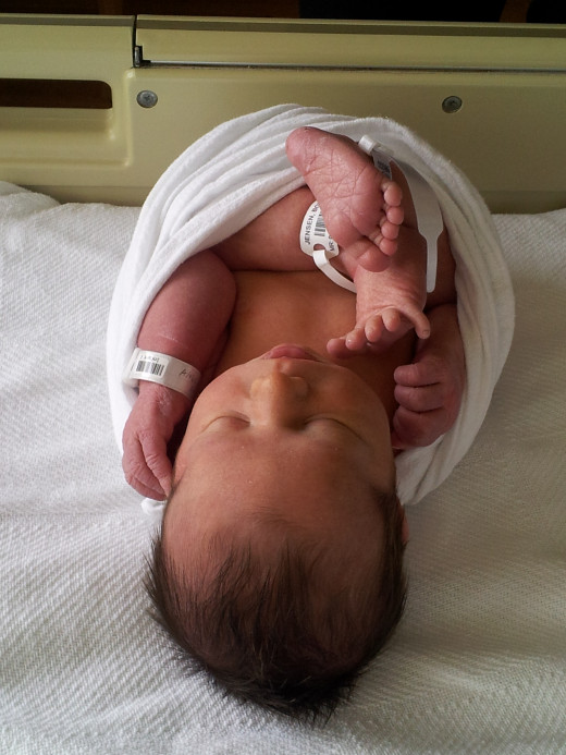 Sleep Achieved in a Swaddle! (This is not how we actually swaddle, but was for newborn photo session purposes. ;-)  )