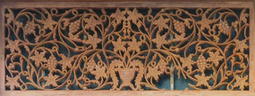 An antique wood carving in a door frame (Gale Fort).