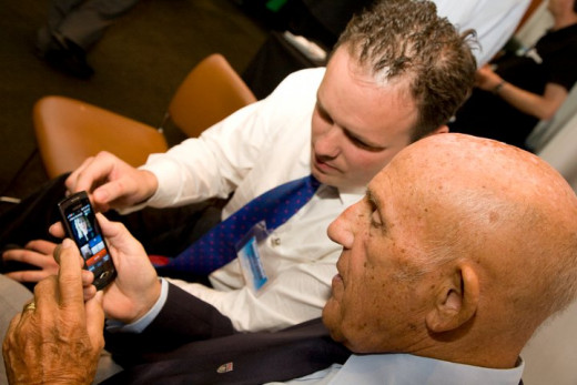 All ages are learning to text. Sir Sterling Moss is taught how to text using a touch screen phone.