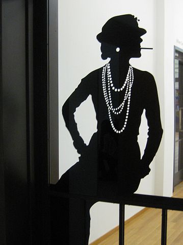 Iconic Coco Chanel pose in silhouette. 