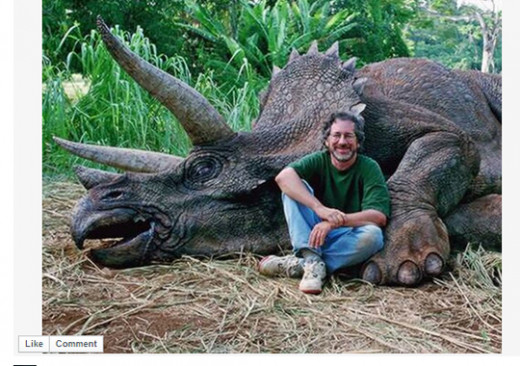 Steven Spielberg posing in front of a dead Triceratops