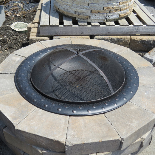 Above view: Cultured stone (top) caps, bowl insert, grate, and safety screen.