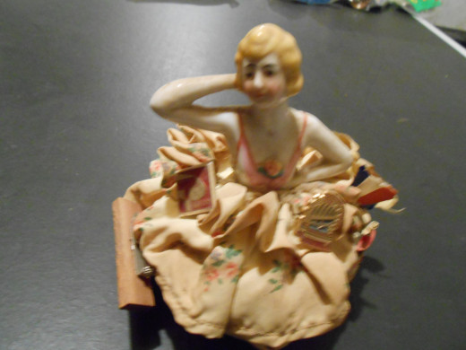 I sold this pin cushion doll on eBay this week for $20.51. It used to be my grandmother's, then my mom's and was handed down to me as a child. It has been sitting in my basement for years, and now it has earned me some money!