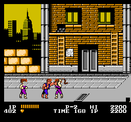 Sometimes, One Enemy Just Stands Around and Watches Their Friend Get Beat Up. It Doesn't Always Happen This Way, but it Sure Is Unrealistic. Other Beat 'Em Up Games Did This Later On Purpose. It's So Unrealistic. (Nice Face Glitch In This Photo)