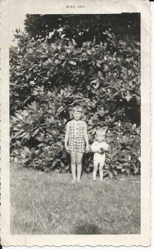 With my little brother, Frankie, who I almost roasted in a chicken coop, in front of the largest magnolia tree in the State of Delaware.