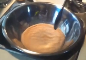 After the yeast has set for ten minutes mix it into the warm water until it is completely dissolved.