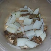 Potatoes, boiled, drained and cut.
