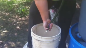 A 5 gallon plastic pail works very well for transferring water.