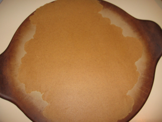The graham cracker dough is rolled out onto a pizza stone.  No need to roll on counter or use nonstick spray.  Easy!