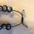 Make the bracelet large enough to fit your wrist. Add the end beads, then tie and seal a knot after each end bead. Make the bracelet large enough to fit your wrist. Add the end beads, then tie and seal a knot after each end bead.