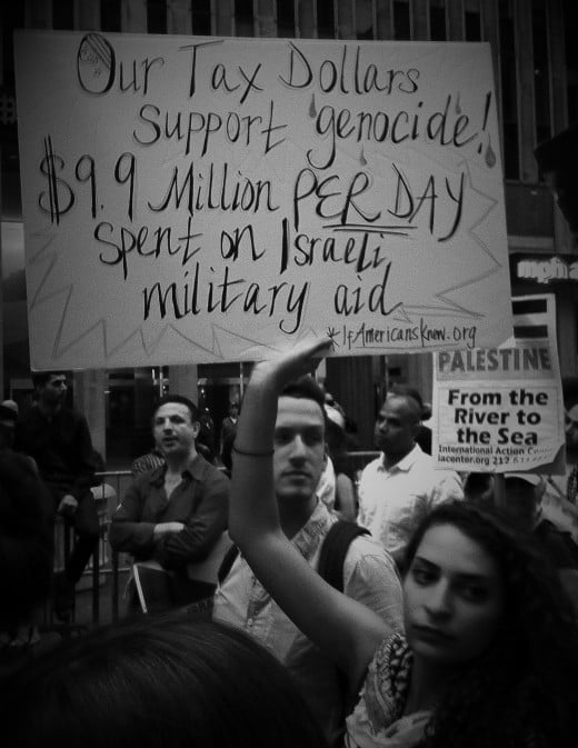 Protester holding sign during the Mass Rally to End Israeli Crimes Against Gaza on August 1, 2014 (NYC). We marched outside of America's news media outlets, who continue to steer the narrative in the favor of Israel in this crisis.