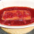 Salmon is turned in marinade to ensure even coating
