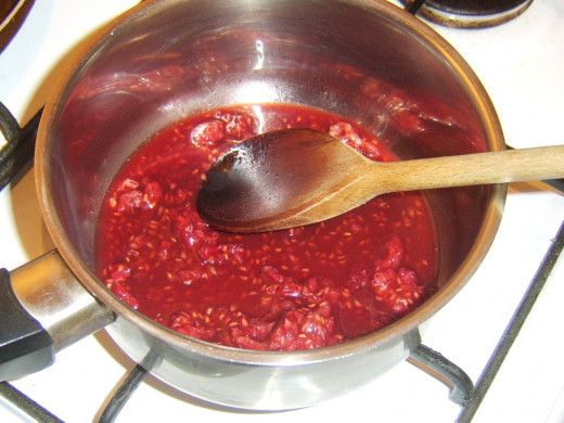 Raspberry, whisky and honey sauce is simmered to reduce and thicken