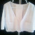 The finished bolero vest with sleeves unrolled. The finished bolero vest with sleeves unrolled.
