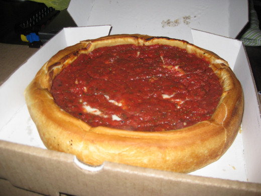 chicago style deep dish pizza in box