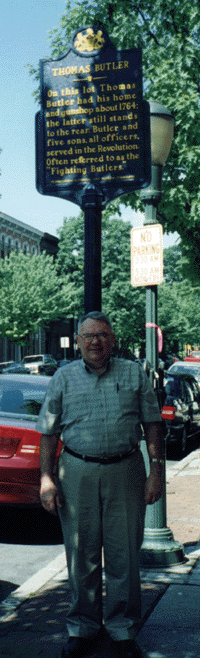 The author, Bill Smith, in front of the Butler sign, in Carlisle, on May 2000 genealogy trip.. 
