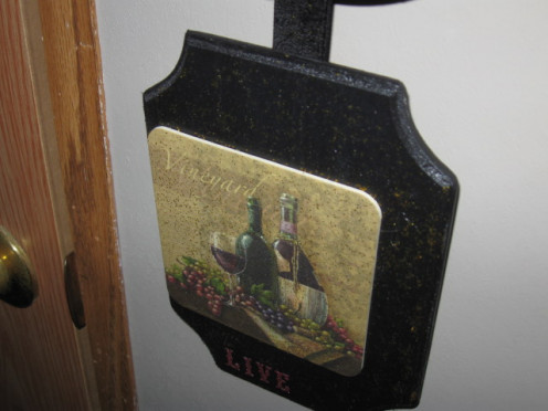 The bottom plaque in the hanging piece.
