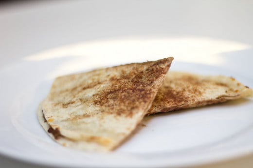 A tortilla grilled with cinnamon sugar and stuffed with chocolate and caramel.