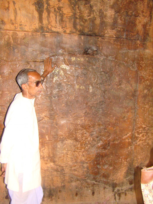 Guide Showing Us The Maha Kashyapa Inscription At Son Bhandar Caves