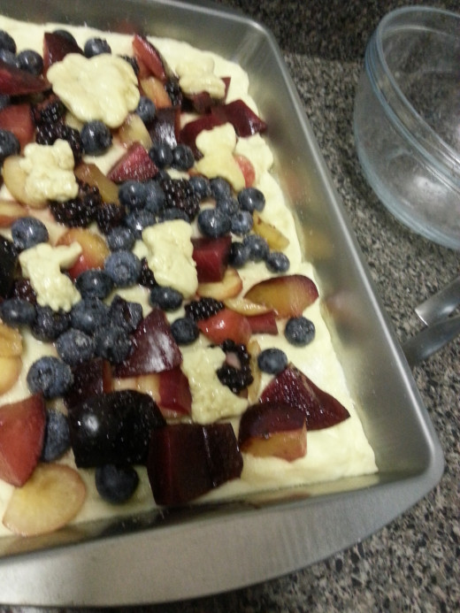 Add the dough shapes to the top. If you don't have a fruit cutter, you can just use dough strips and kriss kross them over the top.