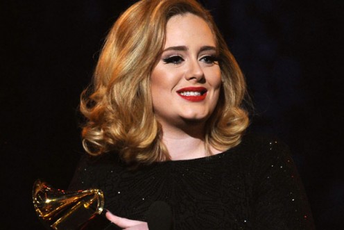 Adele receiving a Grammy Award for Rolling in the Deep