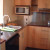 This kitchen had a convection cooktop, a small microwave, a sink with water hookups, some cupboards.  This is more what people think of as a kitchen.