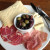 The charcuterie plate can even be a meal, with crackers, veggies/pickles and exotic meats accompanying the cheeses. The charcuterie plate can even be a meal, with crackers, veggies/pickles and exotic meats accompanying the cheeses.
