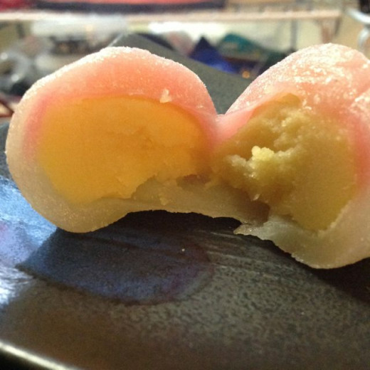Inside is very rich, super-silky-smooth, sweet bean paste.  A bright pink, thin dough layer muffled by the outer dough is the blush of the peach.
