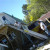These are the men who plan to move the door up the ladder. Larry is on the top, Kosta on the bottom. Keep in mind that Kosta cannot bend over all the way to the bottom rung to give the door a push from the bottom. These are the men who plan to move the door up the ladder. Larry is on the top, Kosta on the bottom. Keep in mind that Kosta cannot bend over all the way to the bottom rung to give the door a push from the bottom.