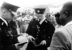 Policemen examine passes