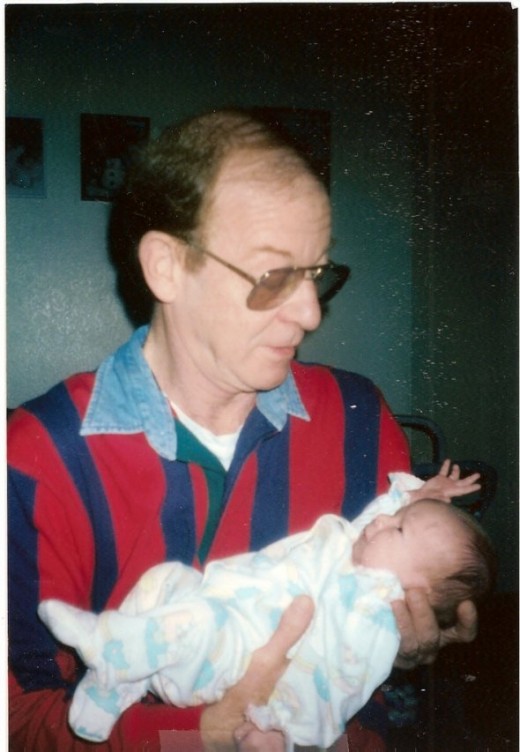 My dad holding my youngest daughter when she was a baby