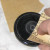 Sand the jar lids. If you're going to paint the entire jar lid, a quick sanding will rough up the surface to let the paint adhere better. Wipe off the dust with a damp rag or paper towel.