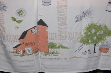 Vintage tablecloth with farm scene.