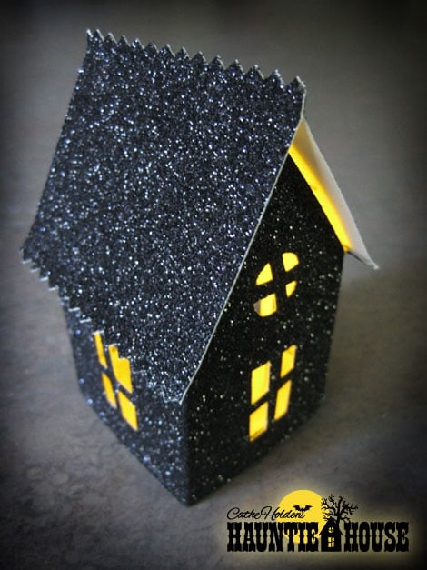 A wonderful but easy haunted house by Cathe at Just Something I Made. Visit her Web site for directions:  http://justsomethingimade.com/2011/08/haunted-house-luminary-party-treat-box-templates/ (clickable link in Link List below)